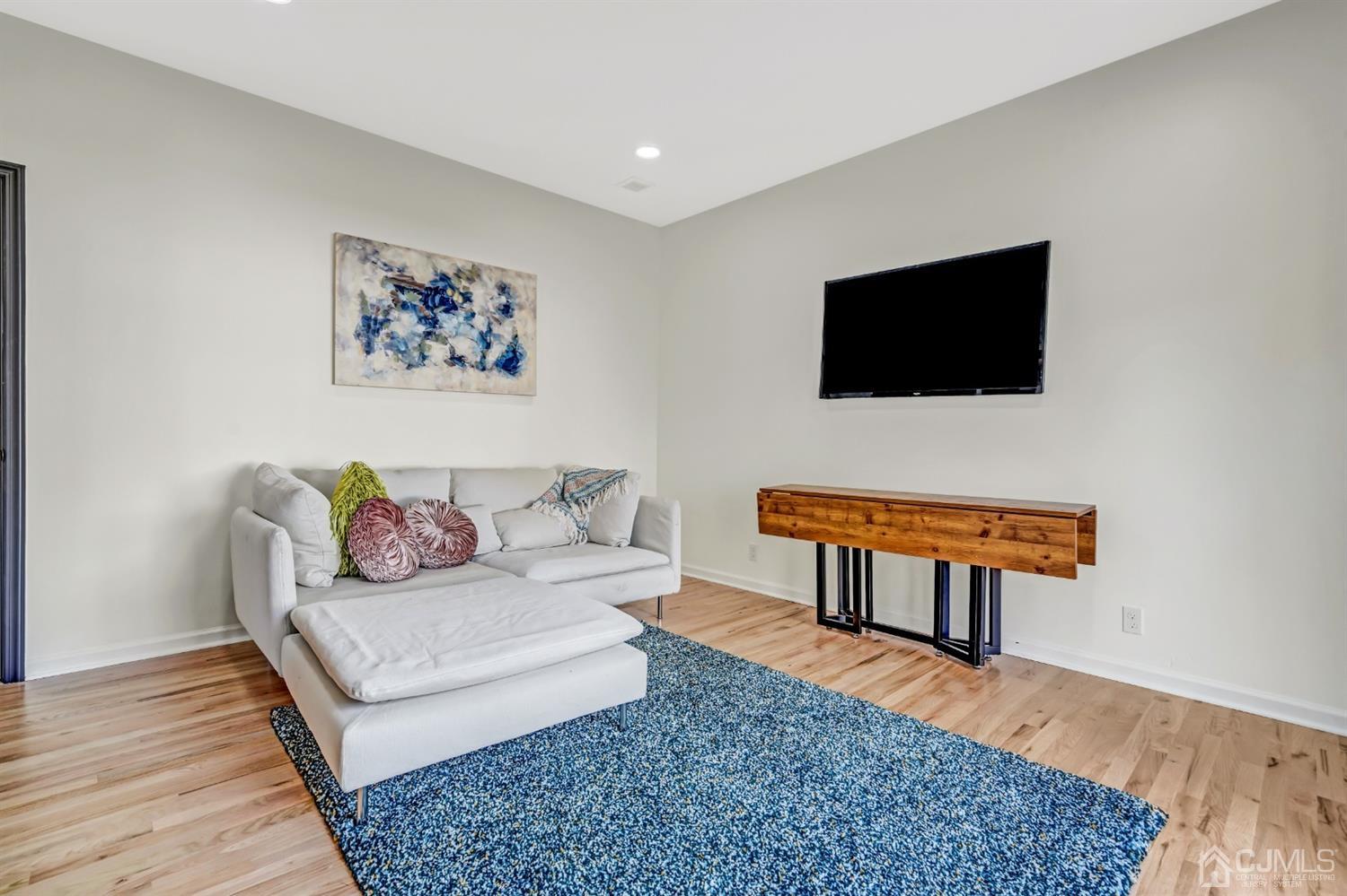 22 Stiles Road Edison, NJ 08817 - Photo 20 of 48 a living room with furniture and a flat screen tv