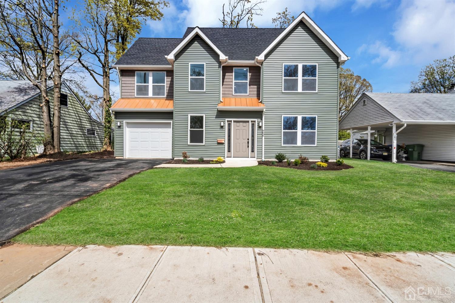 22 Stiles Road Edison, NJ 08817 - Photo 3 of 48 a front view of a house with a yard