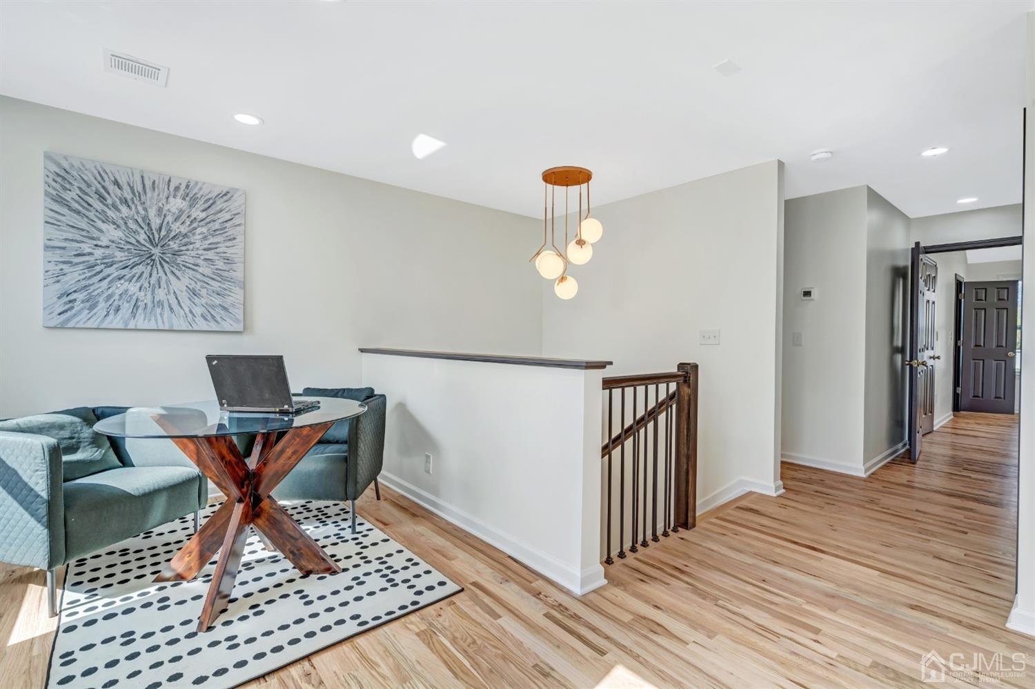 22 Stiles Road Edison, NJ 08817 - Photo 23 of 48 a view of a room with wooden floor and furniture