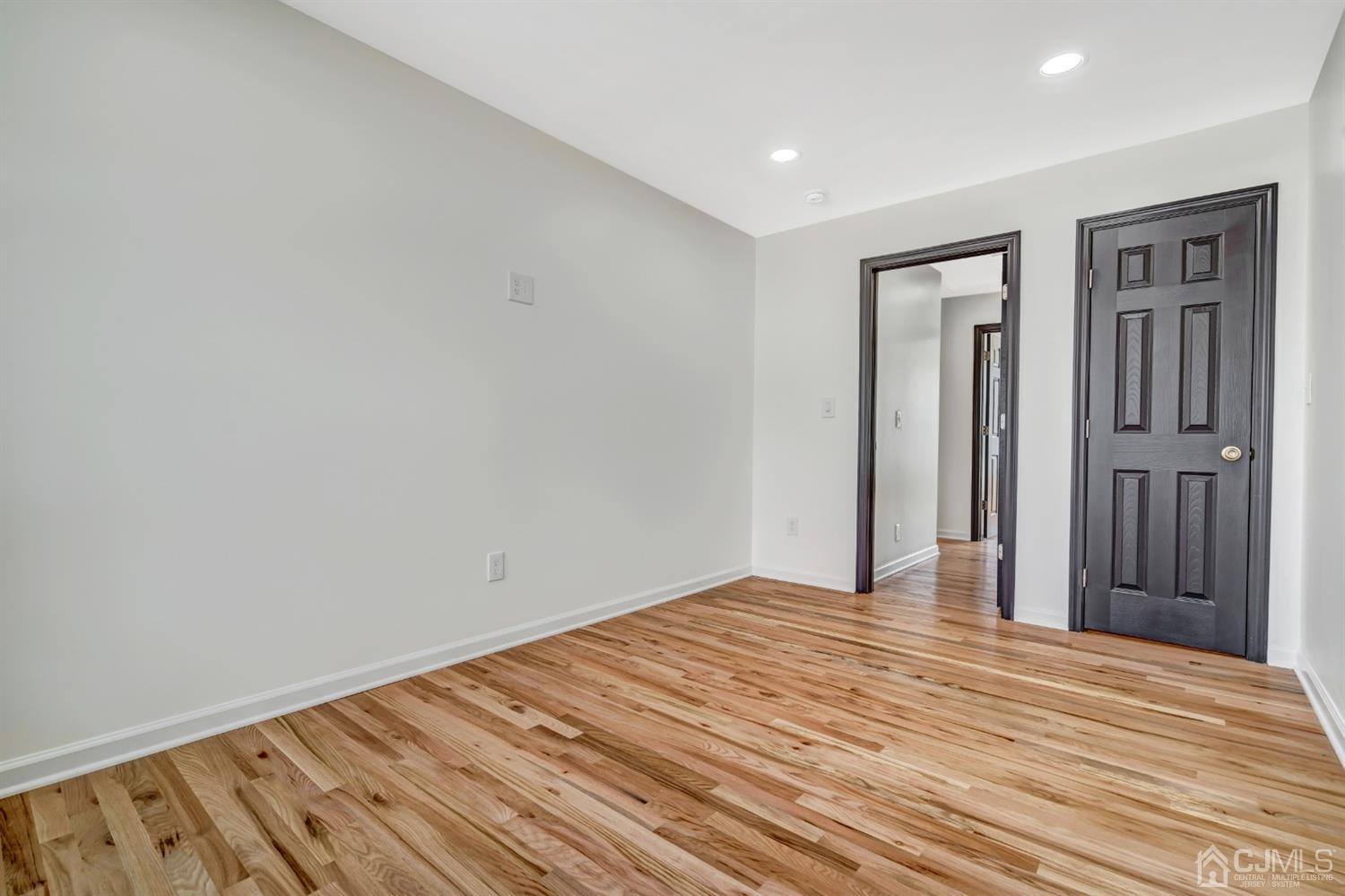 22 Stiles Road Edison, NJ 08817 - Photo 32 of 48 a view of empty room with wooden floor