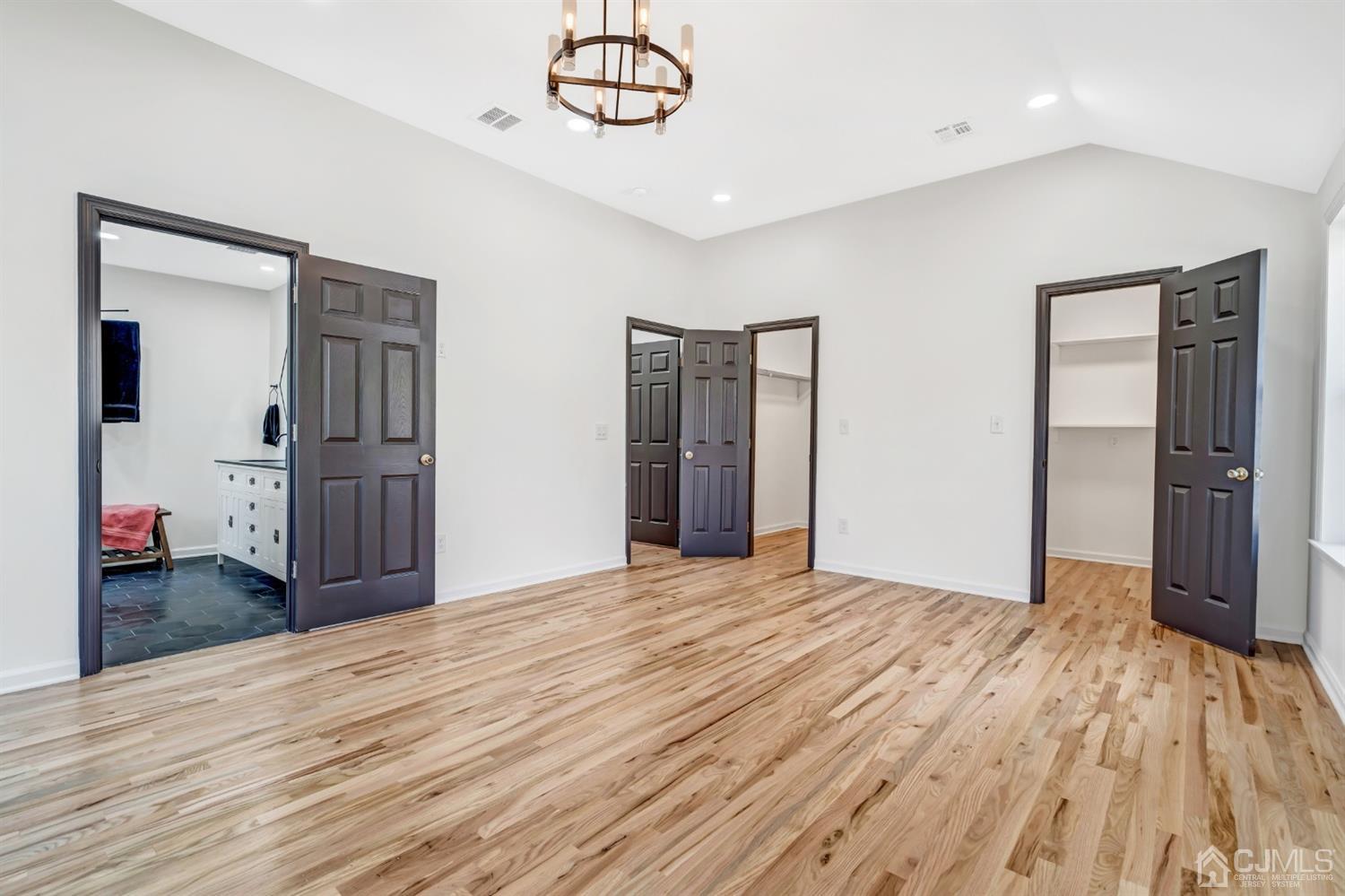 22 Stiles Road Edison, NJ 08817 - Photo 36 of 48 a view of empty room with wooden floor