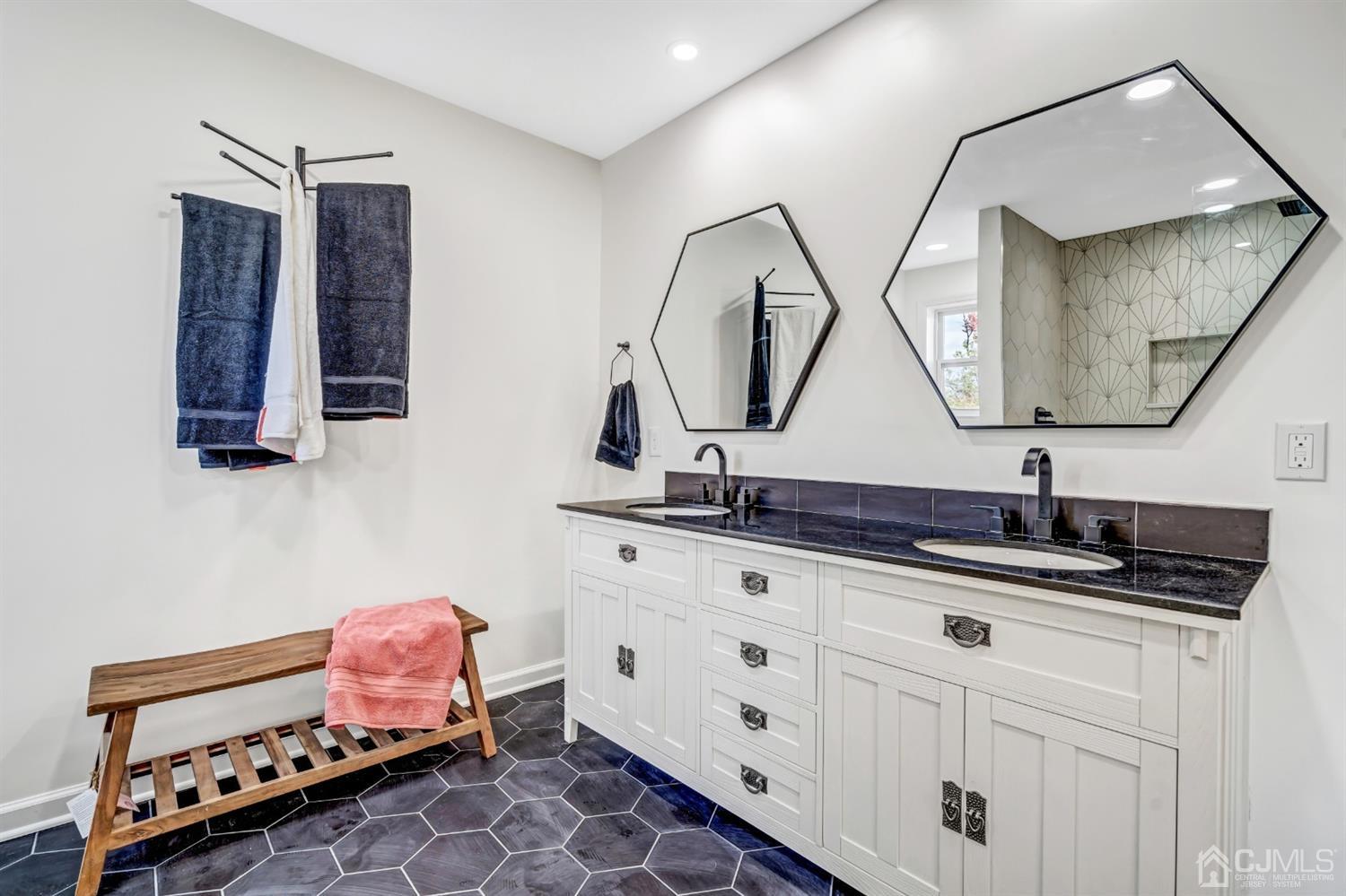 22 Stiles Road Edison, NJ 08817 - Photo 38 of 48 a bathroom with a sink mirror and vanity