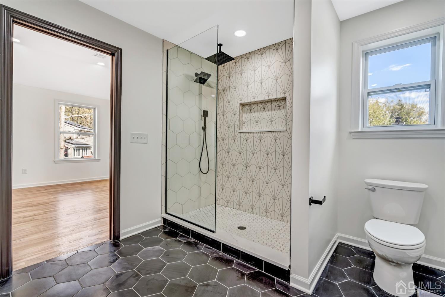 22 Stiles Road Edison, NJ 08817 - Photo 39 of 48 a bathroom with a shower and a toilet