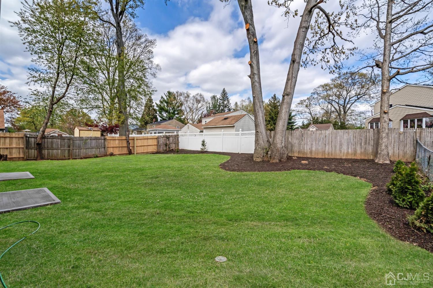 22 Stiles Road Edison, NJ 08817 - Photo 46 of 48 a view of a house with backyard and a tree