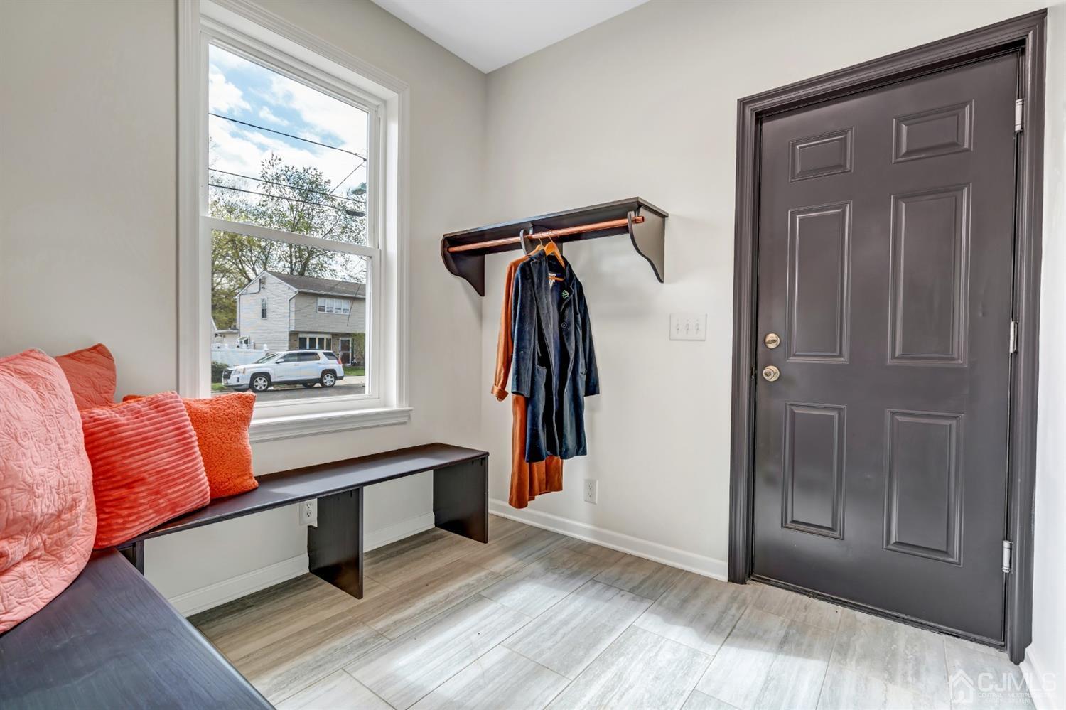 22 Stiles Road Edison, NJ 08817 - Photo 8 of 48 a living room with a couch and a window