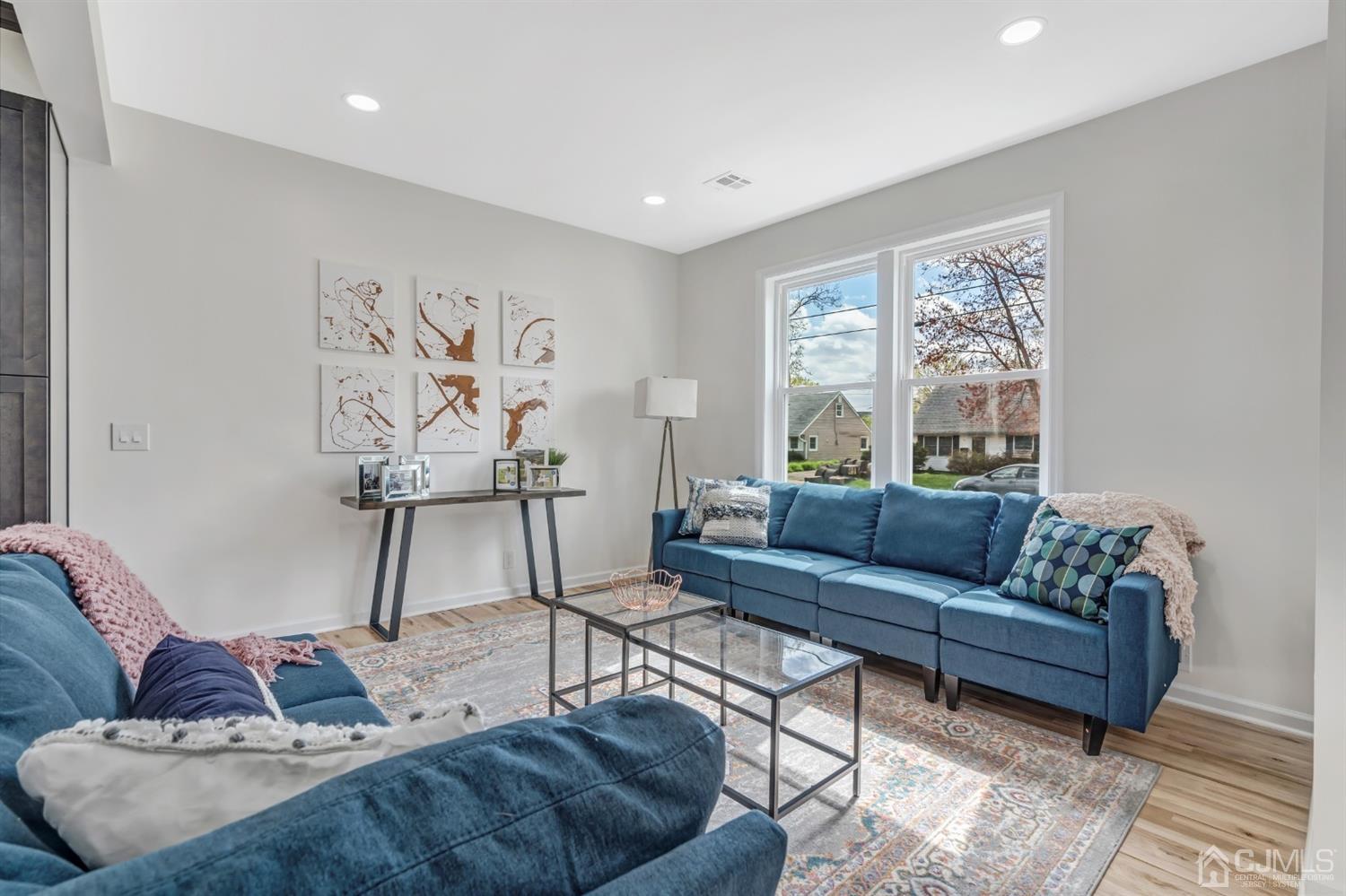 22 Stiles Road Edison, NJ 08817 - Photo 10 of 48 a living room with furniture and a large window