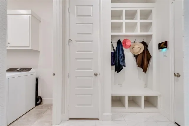 a view of storage and utility room with washer and dryer