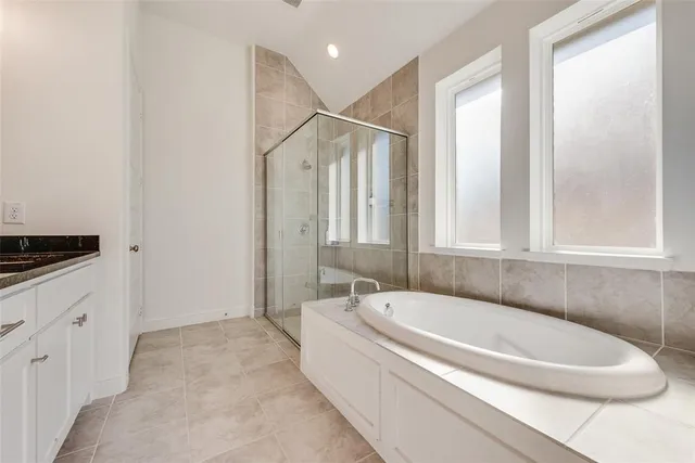 a bathroom with double sink and a mirror