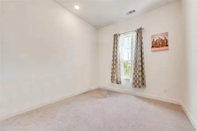 a bedroom with a bed and a desk