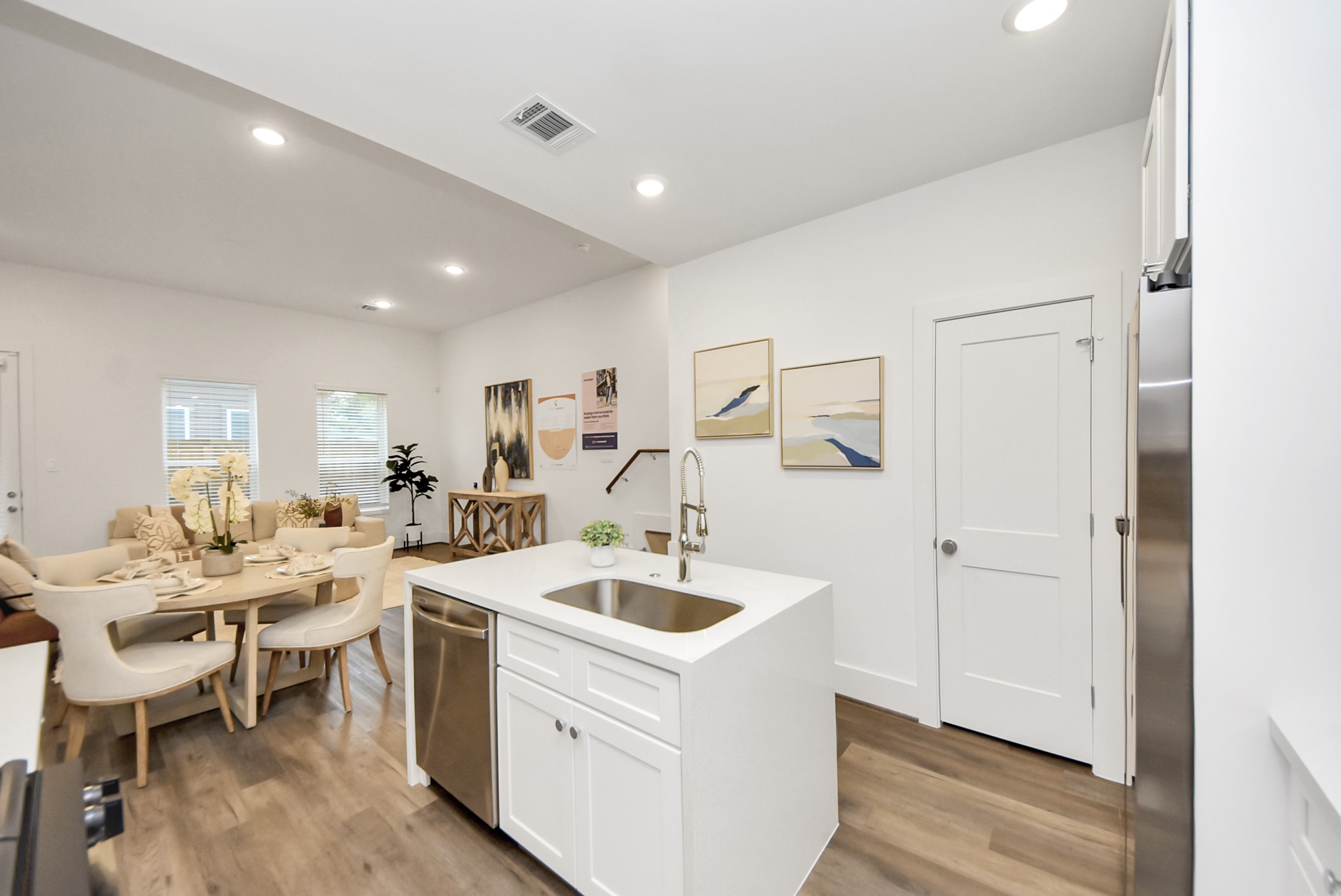 7504 Carver Road, Unit D Houston, TX 77088 - Photo 19 of 49 a large white kitchen with a sink and refrigerator