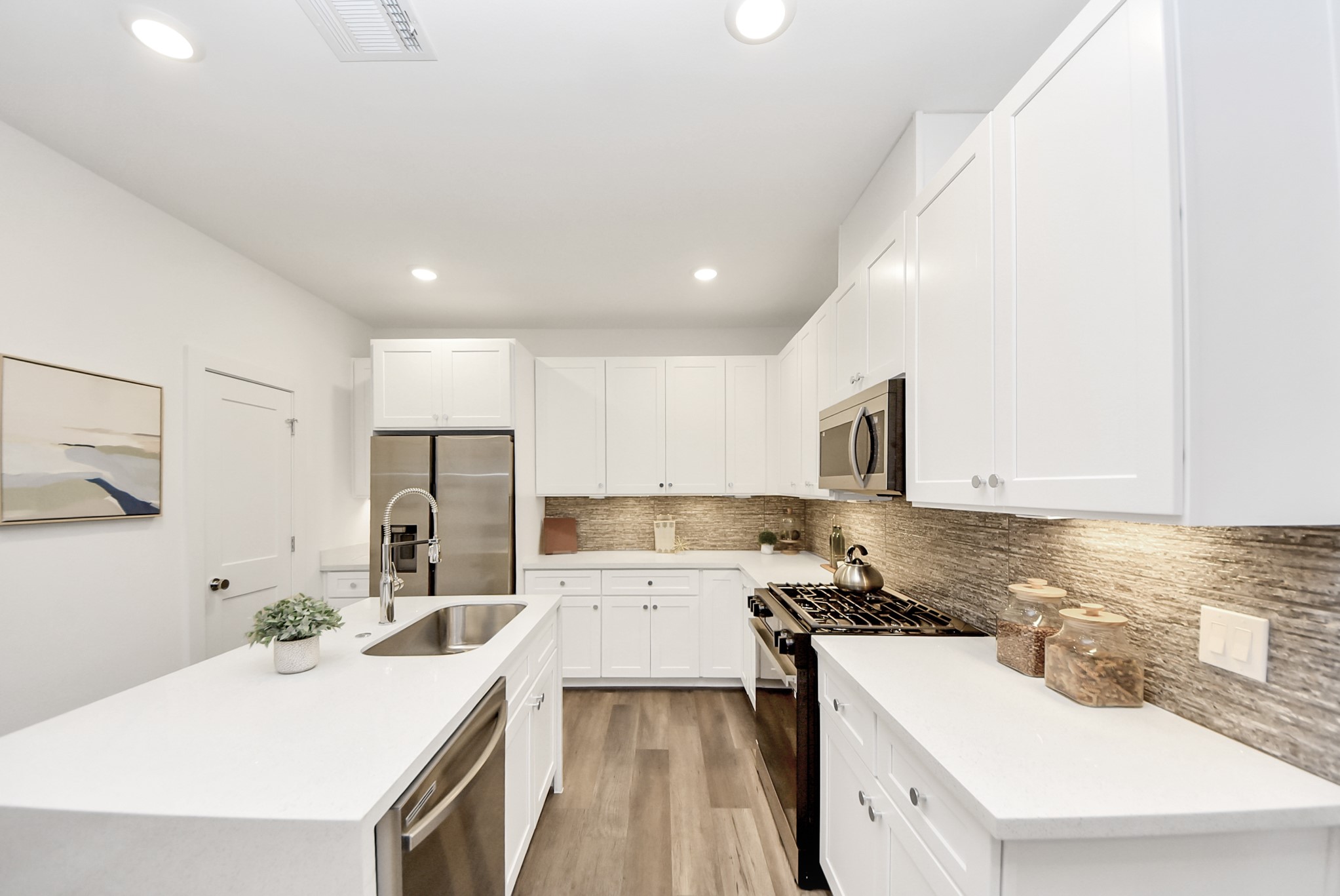 7504 Carver Road, Unit D Houston, TX 77088 - Photo 20 of 49 a kitchen with a sink stove and refrigerator