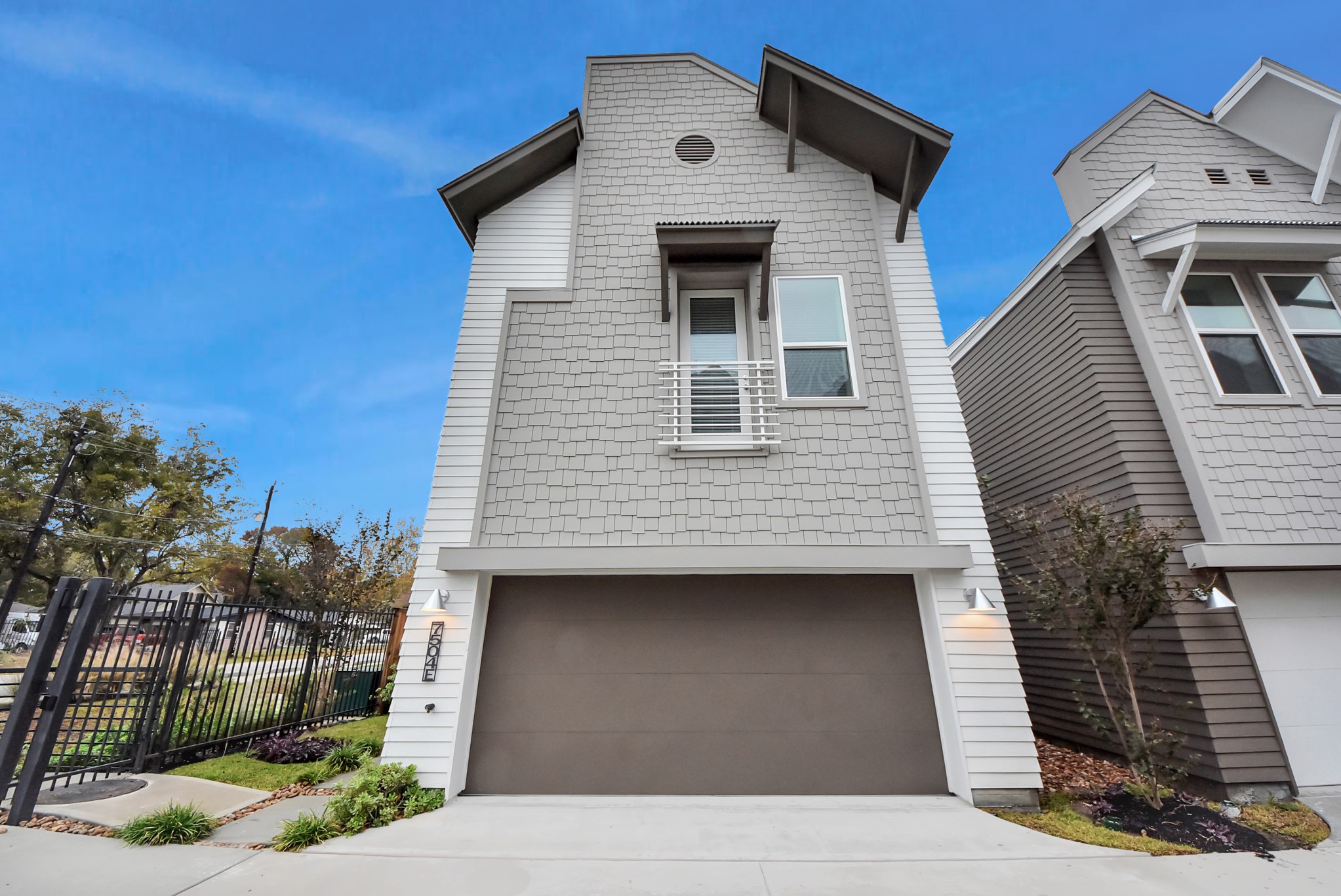 7504 Carver Road, Unit D Houston, TX 77088 - Photo 2 of 49 a front view of a house with garage