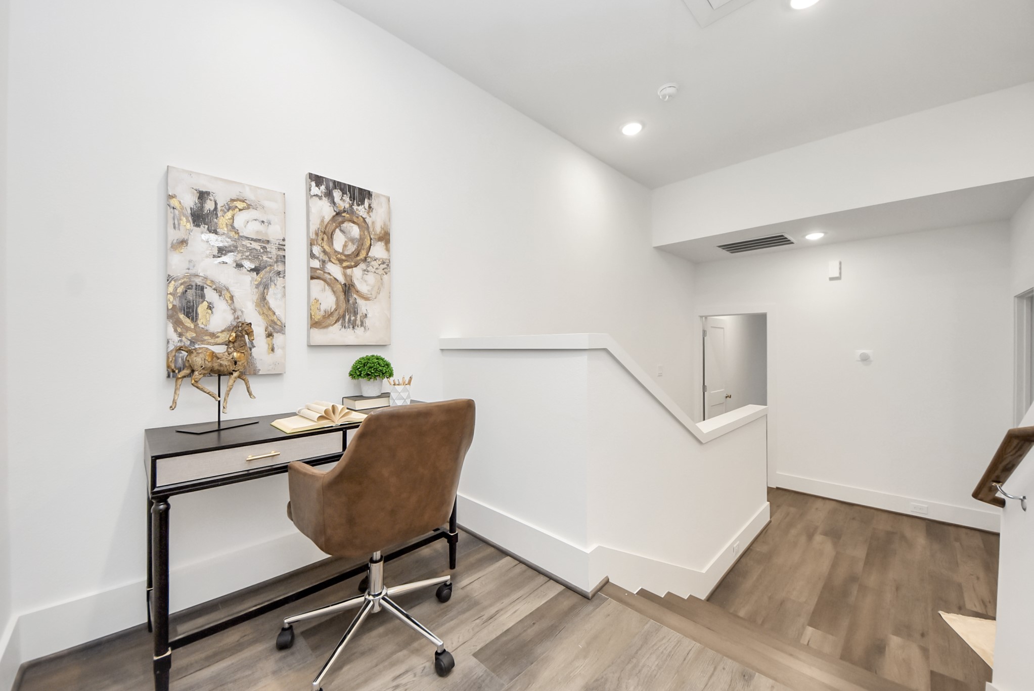 7504 Carver Road, Unit D Houston, TX 77088 - Photo 24 of 49 a view of a workspace with furniture and a potted plant