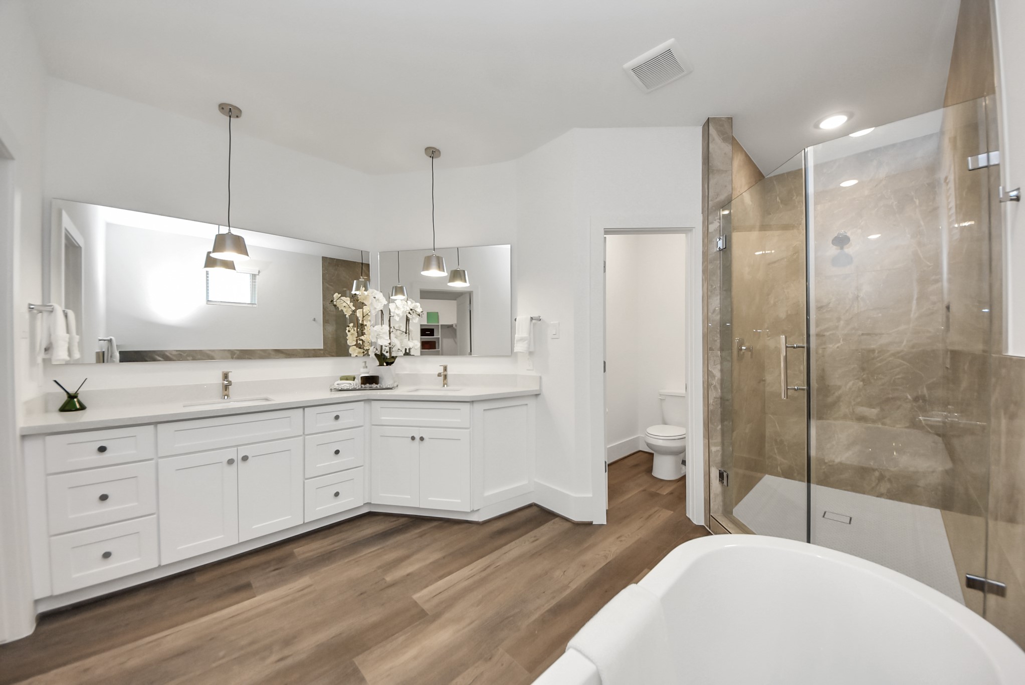 7504 Carver Road, Unit D Houston, TX 77088 - Photo 30 of 49 a spacious bathroom with a granite countertop tub sink a mirror and a shower