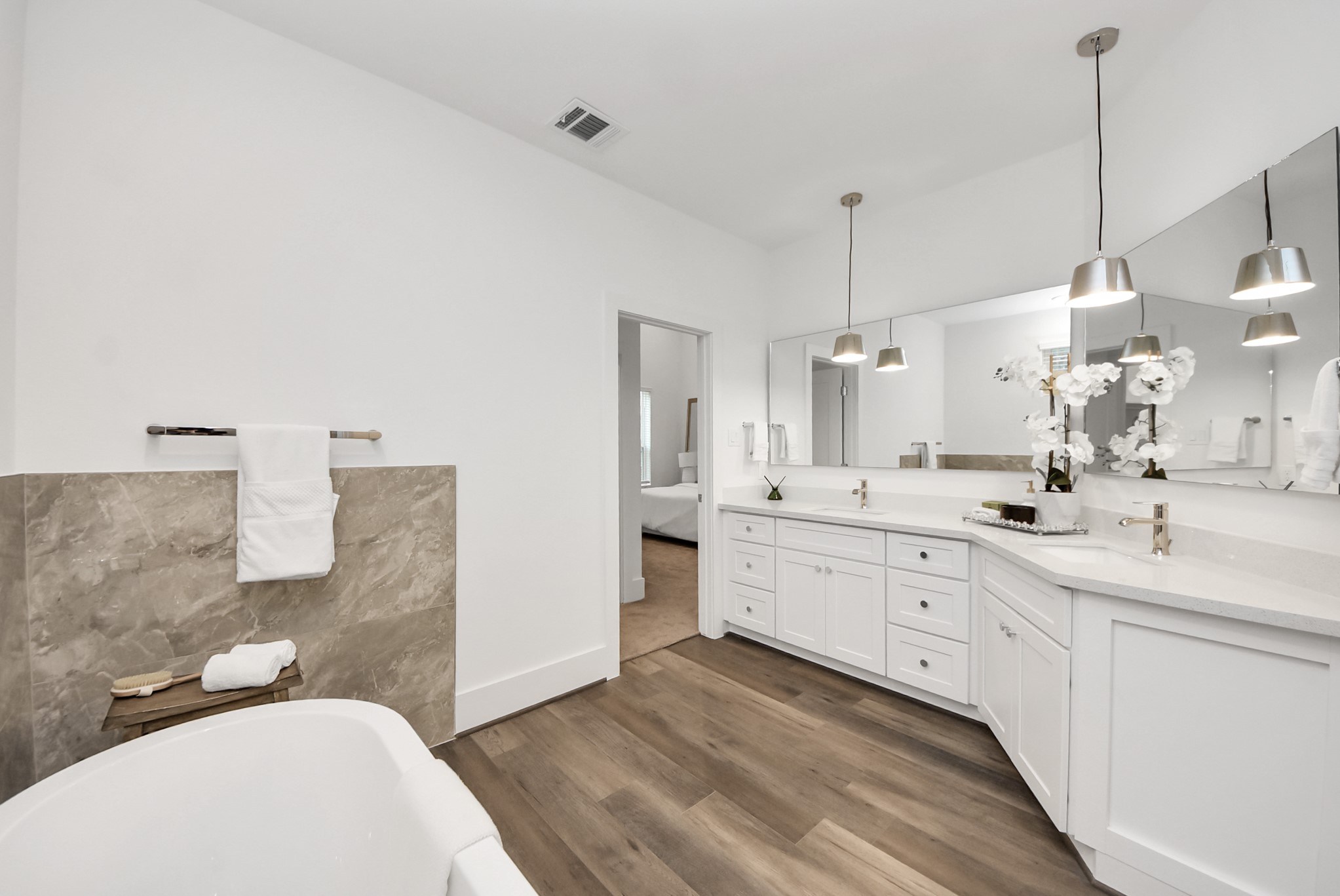 7504 Carver Road, Unit D Houston, TX 77088 - Photo 31 of 49 a spacious bathroom with a double vanity sink a mirror and a bathtub