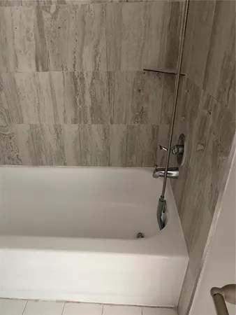 a view of a livingroom with an empty space and a window