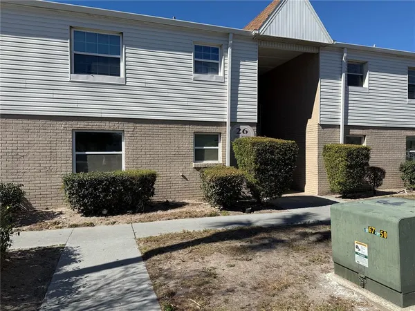 a view of an empty room and a window