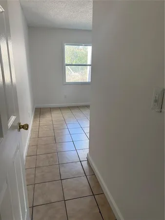 a view of a yard with a wooden fence