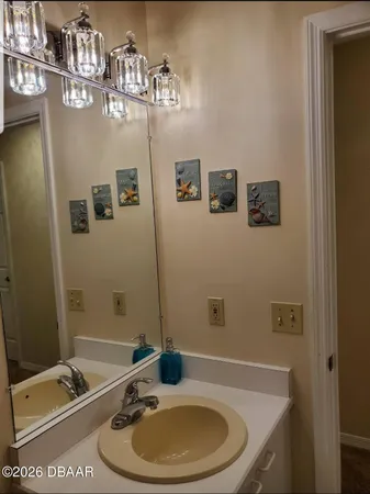 a bathroom with a granite countertop sink a toilet and bathtub