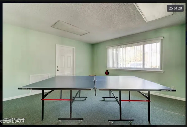 a room with table and chairs