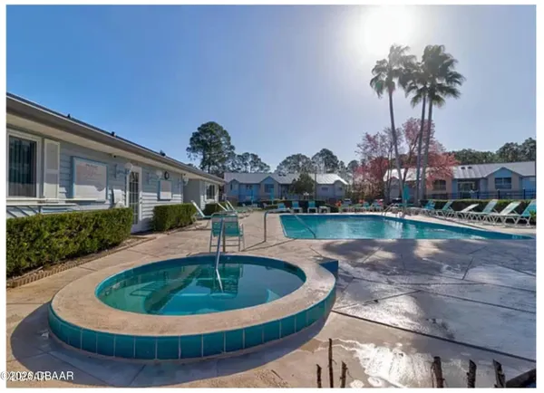 a view of a lake with a house in the background