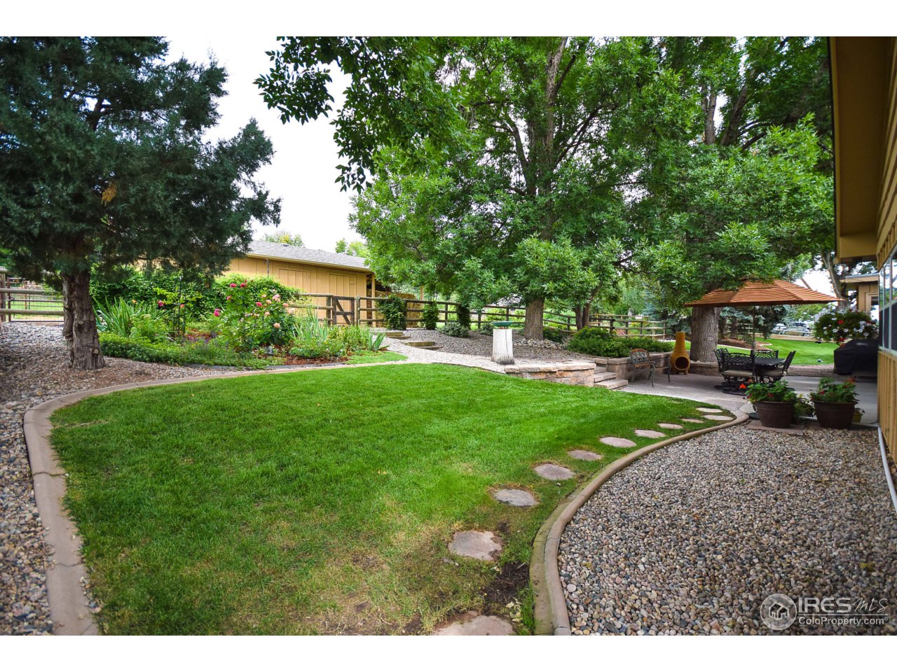 3501 Bayshore Road Fort Collins, CO 80524 - Photo 23 of 25 a front view of a house with garden