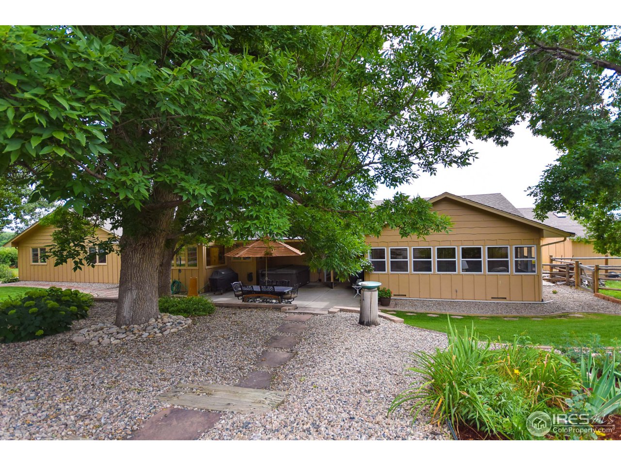3501 Bayshore Road Fort Collins, CO 80524 - Photo 24 of 25 a view of a house with a yard and sitting area