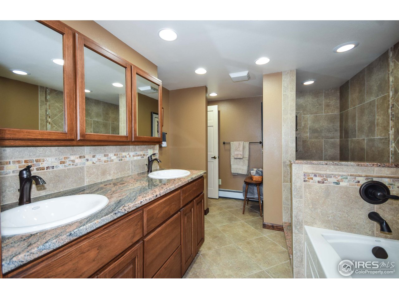 3501 Bayshore Road Fort Collins, CO 80524 - Photo 7 of 25 a bathroom with a sink a toilet a mirror and shower