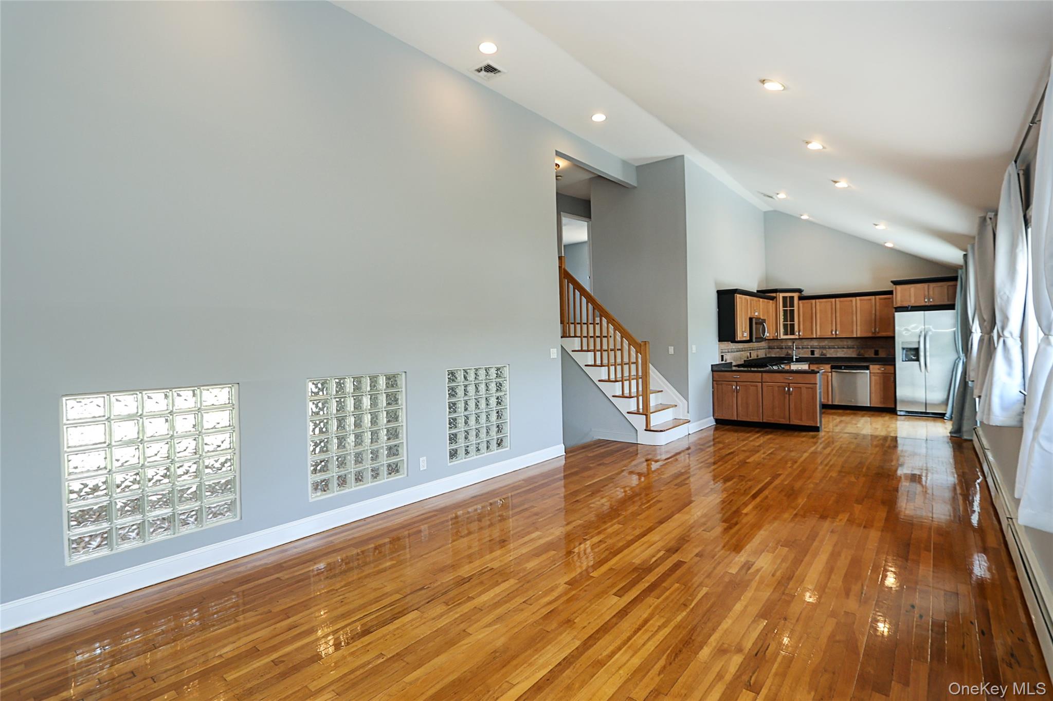 874 Seamans Nck Road Wantagh, NY 11793 - Photo 14 of 39 wooden floor in an empty room with a window