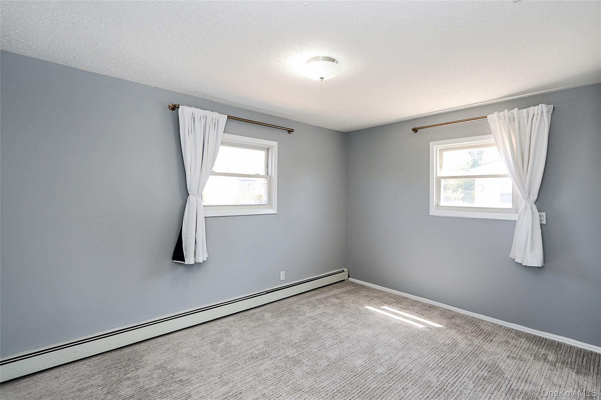 874 Seamans Nck Road Wantagh, NY 11793 - Photo 24 of 39 an empty room with windows