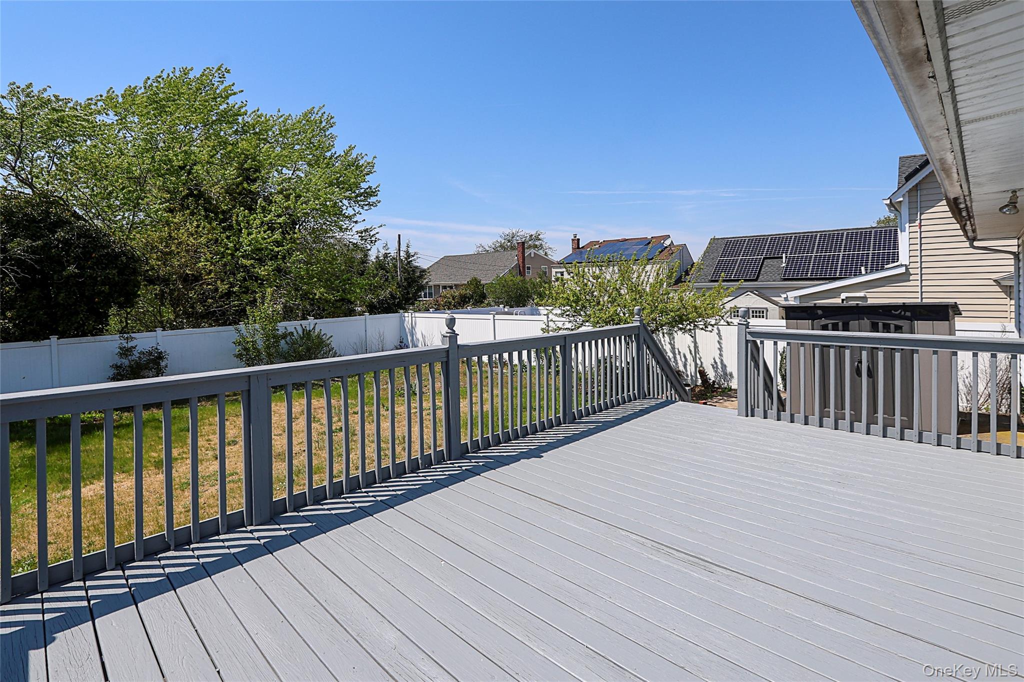 874 Seamans Nck Road Wantagh, NY 11793 - Photo 28 of 39 a view of a roof with wooden floor and fence