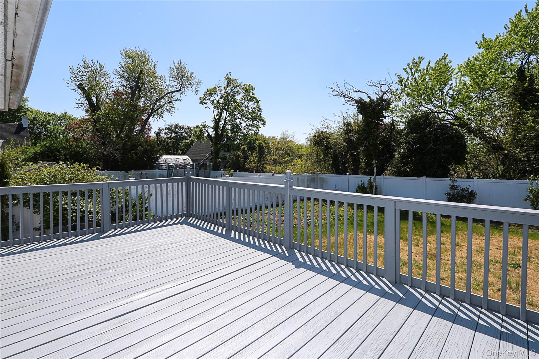 874 Seamans Nck Road Wantagh, NY 11793 - Photo 29 of 39 a balcony with wooden floor and fence