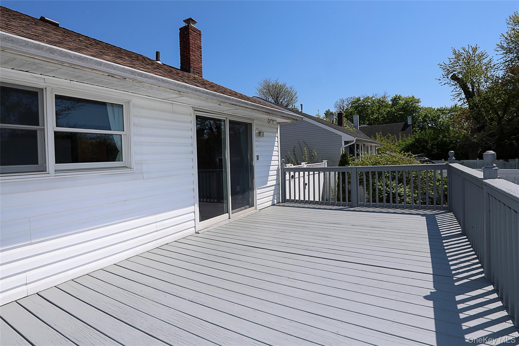 874 Seamans Nck Road Wantagh, NY 11793 - Photo 30 of 39 a view of a house with wooden deck