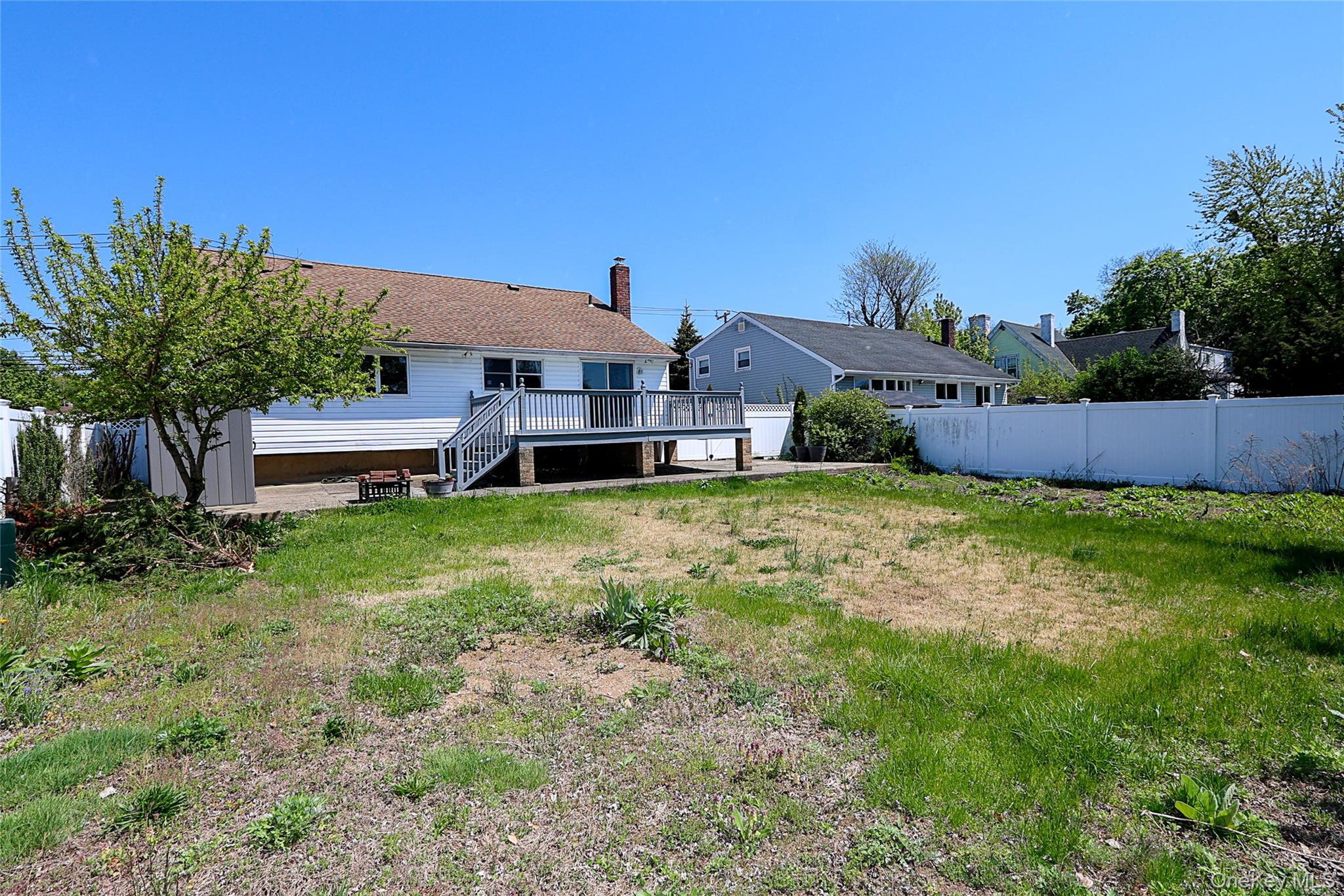 874 Seamans Nck Road Wantagh, NY 11793 - Photo 33 of 39 a front view of a house with a yard