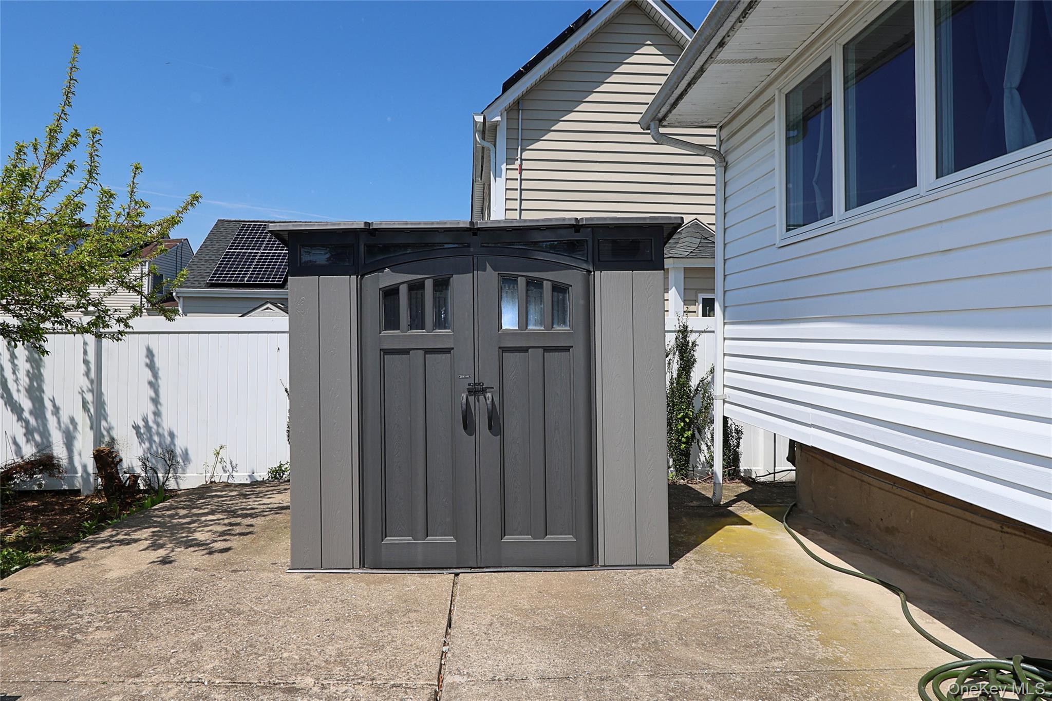 874 Seamans Nck Road Wantagh, NY 11793 - Photo 35 of 39 a view of a house with a backyard