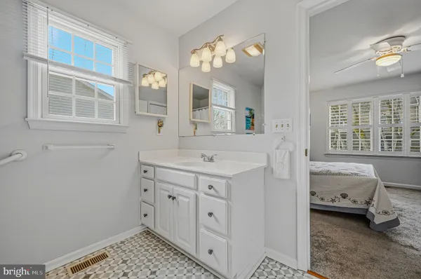 a bathroom with a sink and a shower curtain