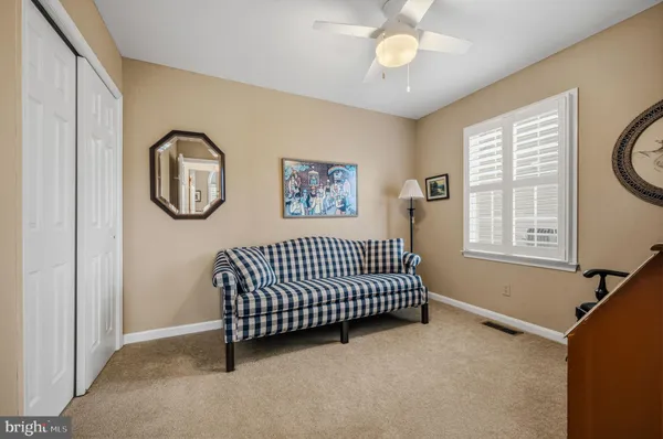 a bedroom with bed and a window