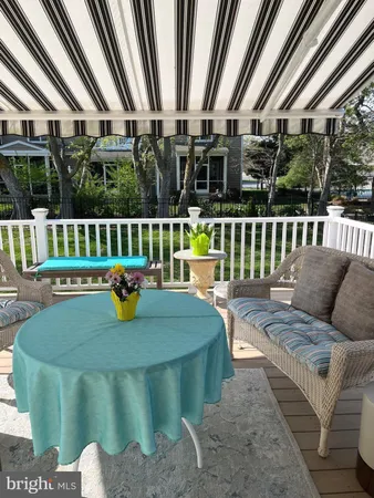 a view of house with a deck