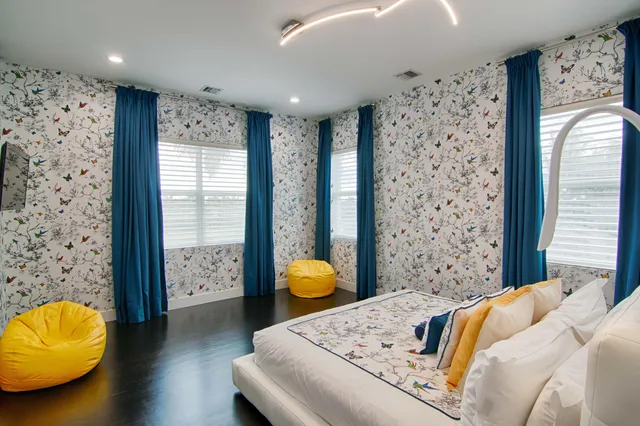 a kitchen with kitchen island a sink stainless steel appliances and cabinets