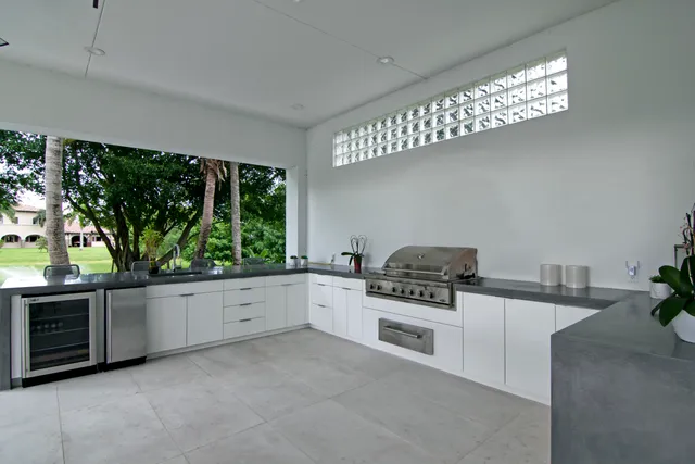a view of a hallway with wooden floor and furniture