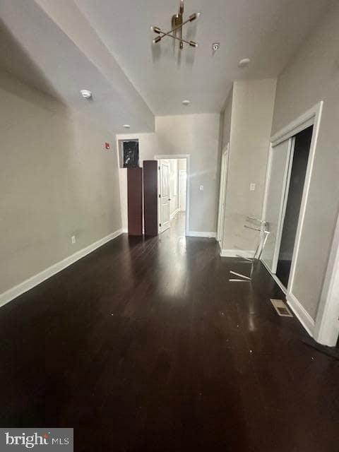 3010 North Broad Street, Unit 1 Philadelphia, PA 19132 - Photo 4 of 10 an empty room with wooden floor and windows