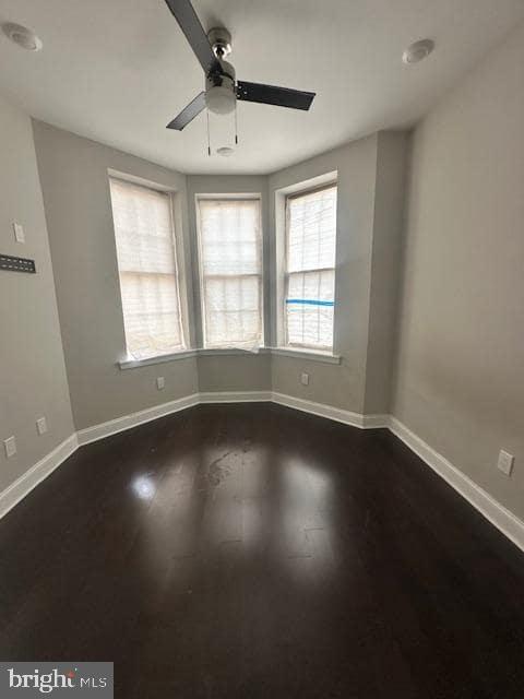 3010 North Broad Street, Unit 1 Philadelphia, PA 19132 - Photo 6 of 10 an empty room with wooden floor and windows