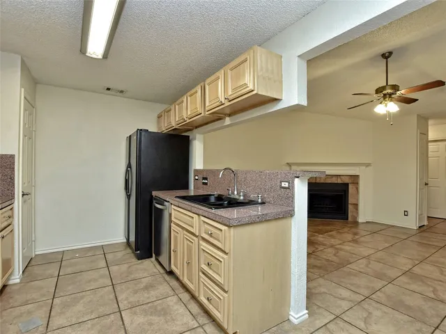 a kitchen with a stove and a refrigerator