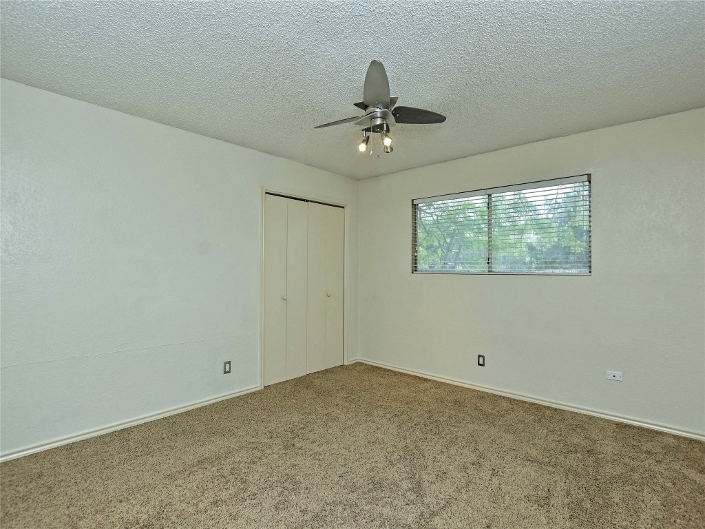 415 Fantail Loop, Unit B Austin, TX 78734 - Photo 7 of 10 a view of an empty room with a window