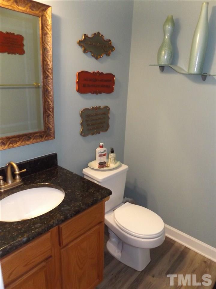 7311 Bonnie Ridge Court Raleigh, NC 27615 - Photo 6 of 20 Granite Counter tops in powder room