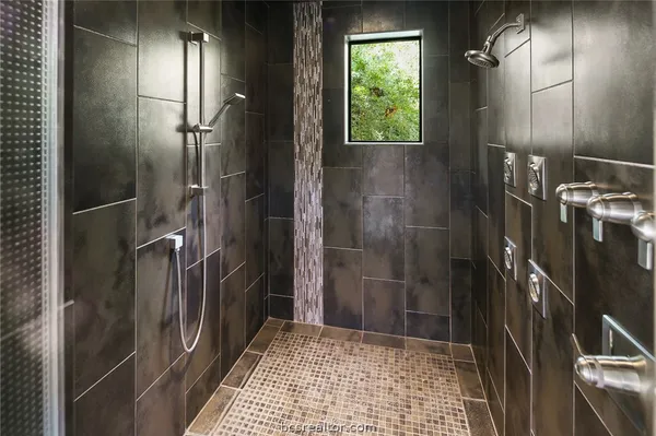 a view of walk in closet and bedroom