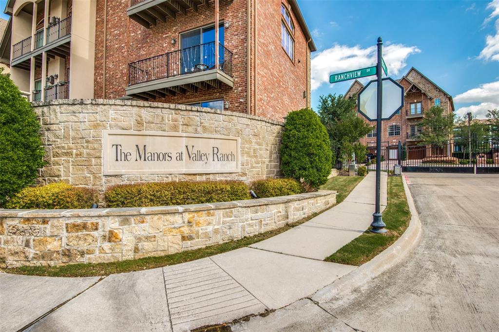 a view of a fountain with the bench of building