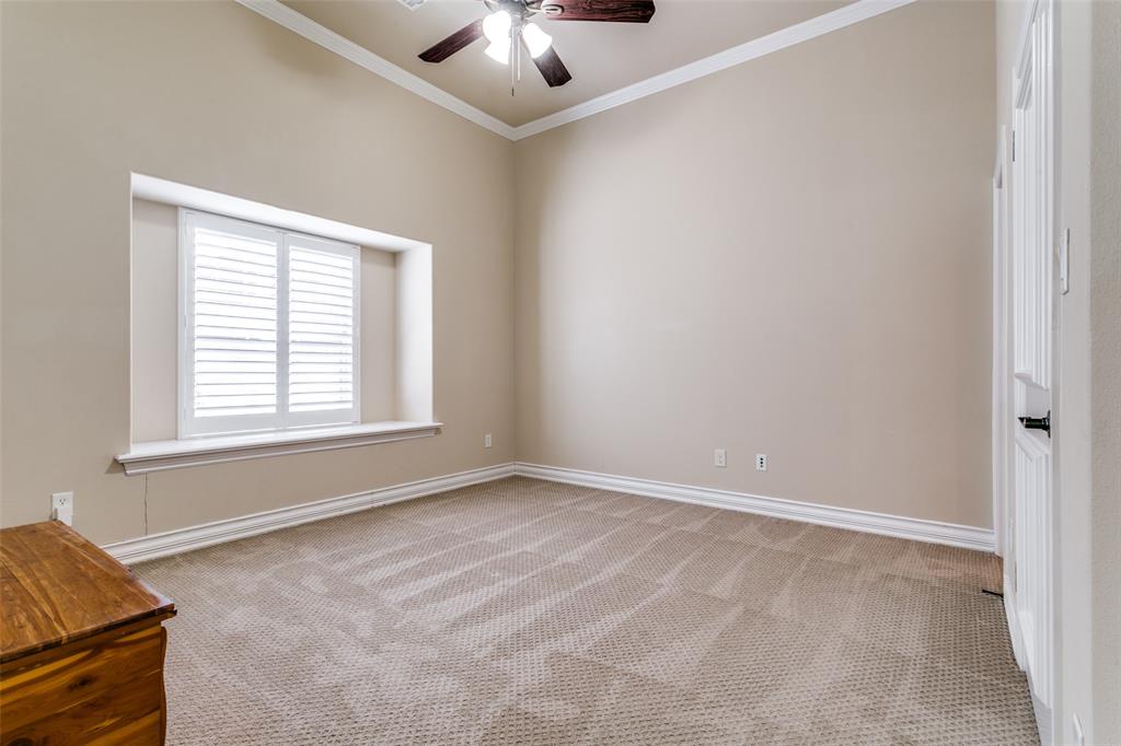 800 Rockingham Drive Irving, TX 75063 - Photo 11 of 35 an empty room with windows and chandelier fan