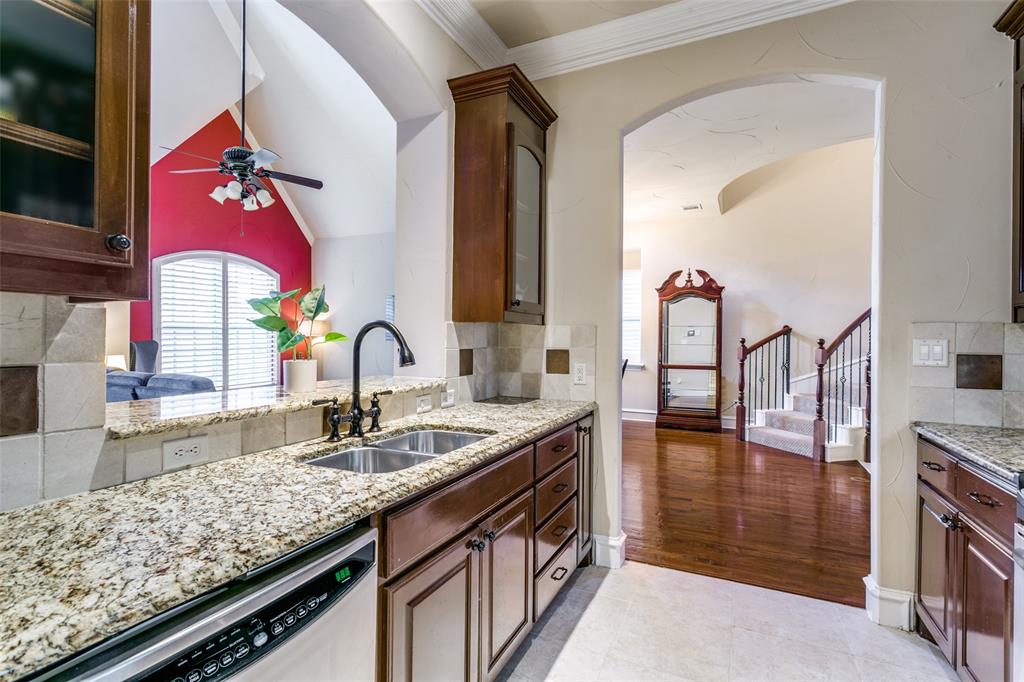 800 Rockingham Drive Irving, TX 75063 - Photo 20 of 35 a kitchen with stainless steel appliances granite countertop a sink and cabinets