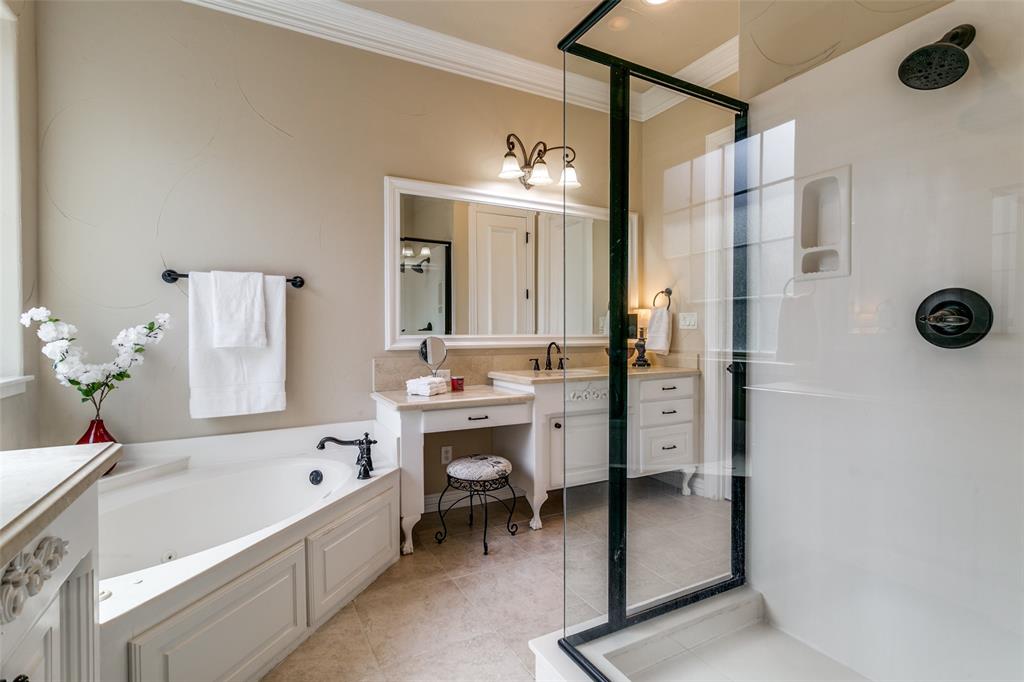 800 Rockingham Drive Irving, TX 75063 - Photo 26 of 35 Bathroom featuring vanity, a jetted tub, stand up shower